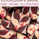 a photo of a pile of swirled chocolate bark with raspberries by sweet simple vegan for pinterest