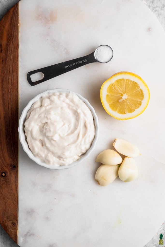 Vegan mayonnaise, lemon, garlic and salt for homemade garlic aioli by sweet simple vegan