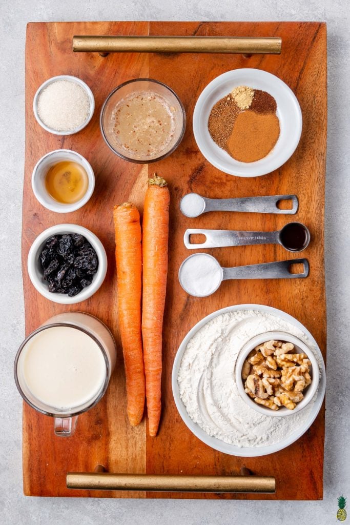 ingredients for vegan carrot cake pancakes on a wooden board by sweet simple vegan