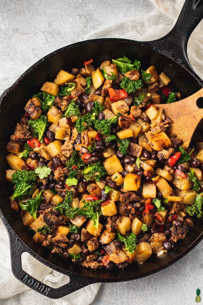 Vegan Breakfast Potato Hash in a cast iron skillet by sweet simple vegan