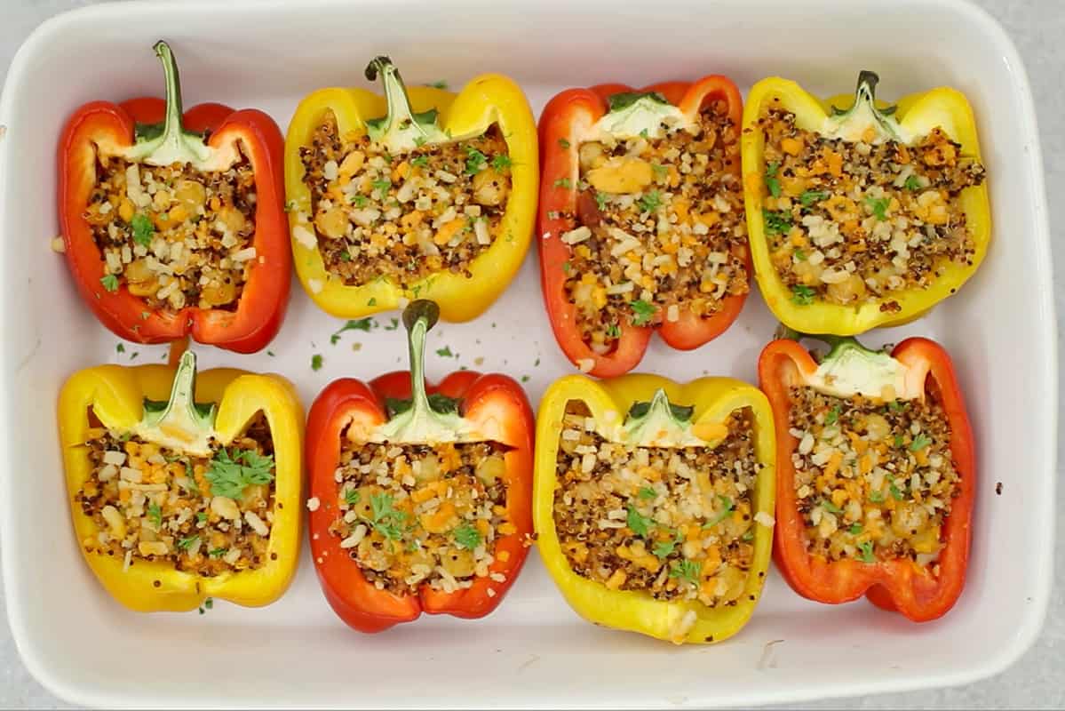 stuffed bell peppers in white baking dish