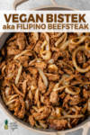 A close up of bistek tagalog aka filipino beefsteak in a pan for pinterest