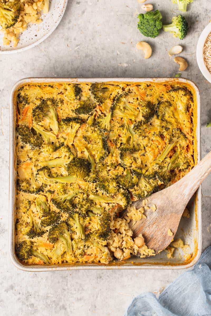 overhead image of cooked broccoli rice casserole with spoon