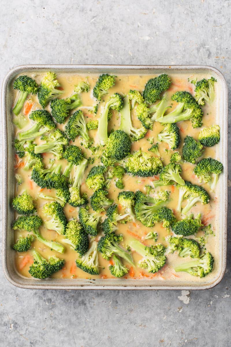 overhead image of uncooked cheesy broccoli rice casserole