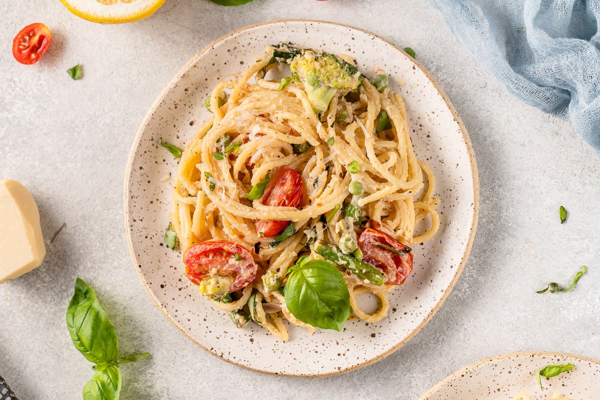 overhead image of pasta primavera on a white plate