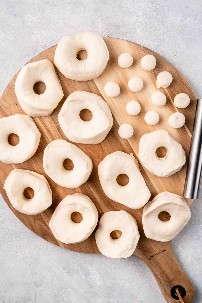 uncooked biscuit donuts with whole cut in them