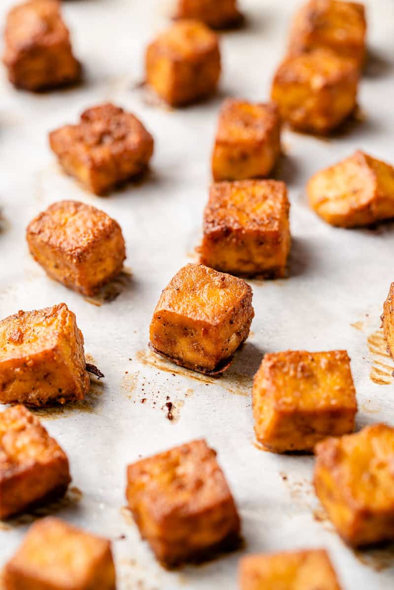 crispy baked tofu on pan lined with parchment paper