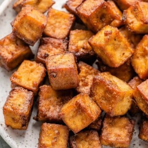 crispy baked tofu on a white speckled plate