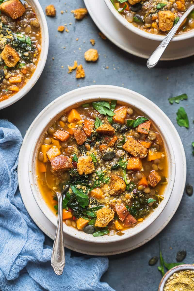 overhead image of sweet potato lentil soup with spoon