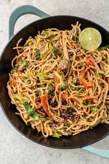 overhead image of wok filled with easy vegetable stir fry with peanut sauce