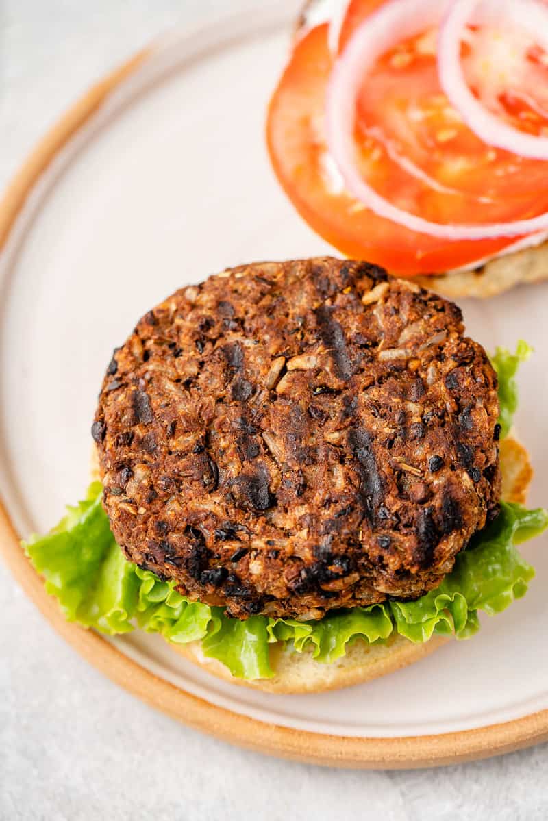 Grillable veggie burgers with lettuce, tomato and onions by sweet simple vegan