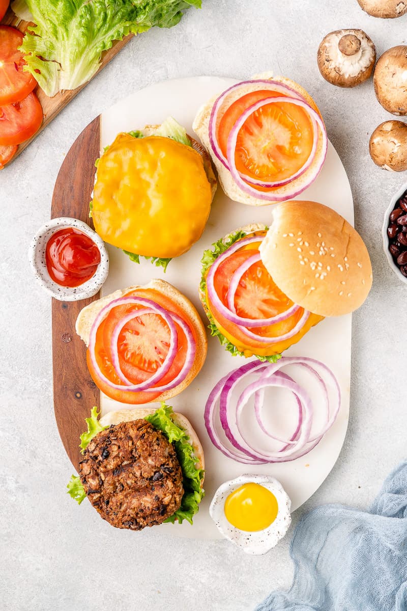 overhead image of burgers on a white tray