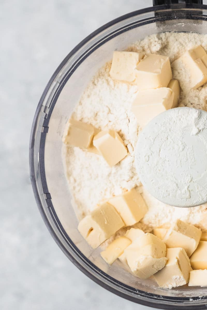 cubed butter and flour in a food processor for buttermilk biscuits