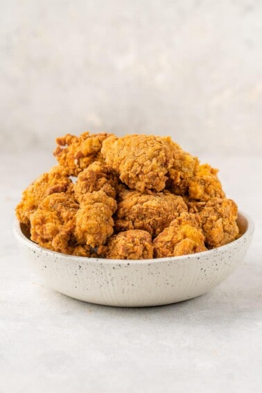 straight forward image of vegan KFC fried chicken in bowl on white background
