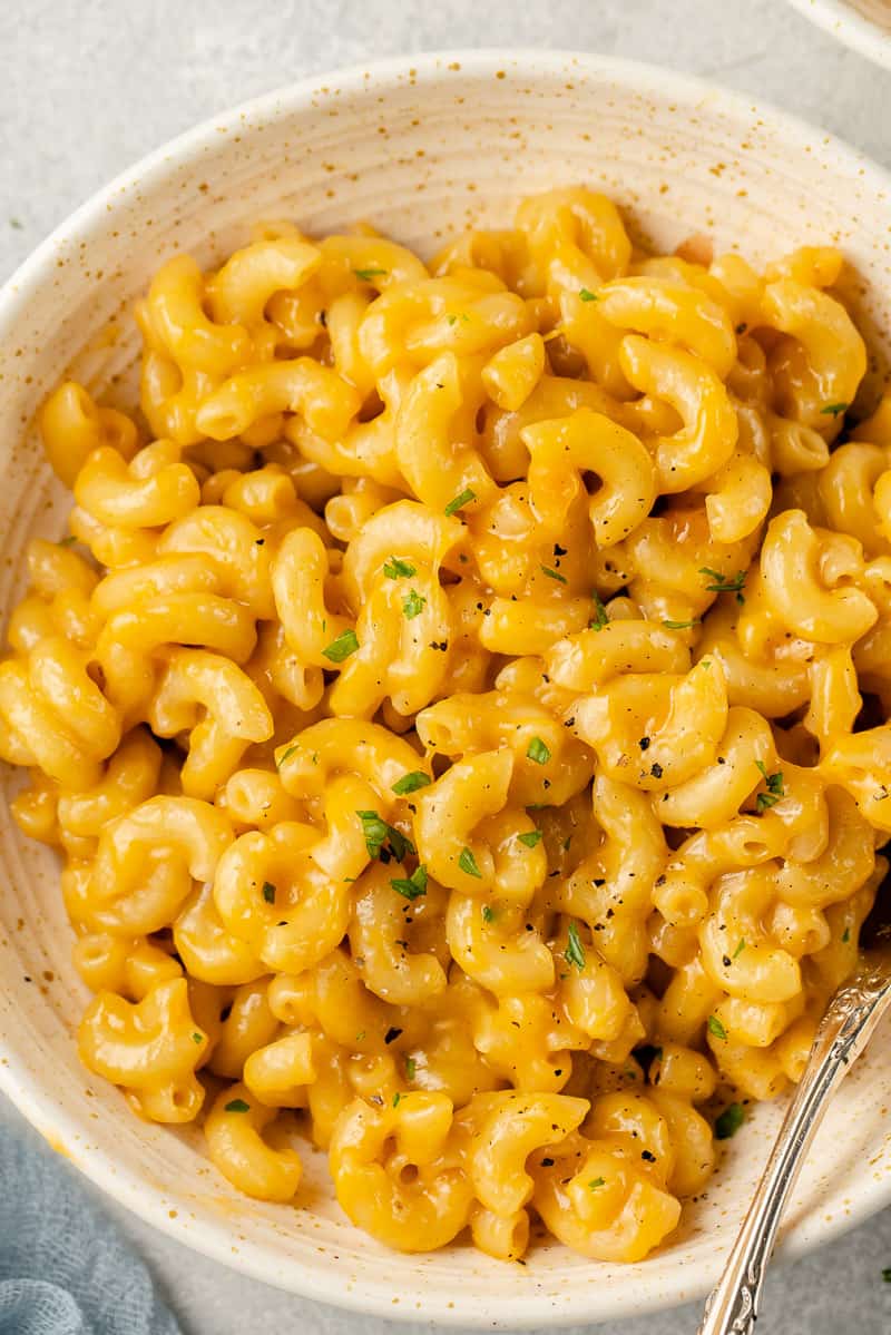 a close up of vegan mac and cheese in a white bowl