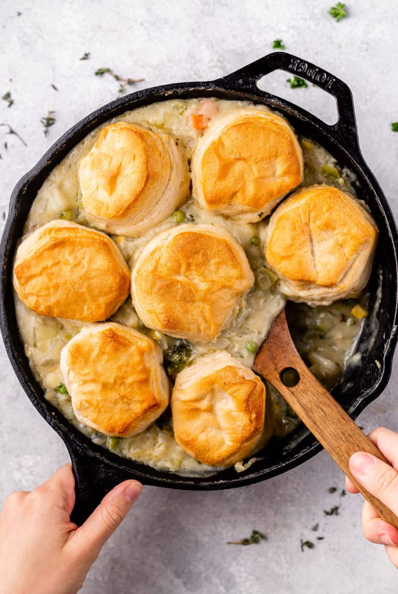 overhead image of skillet biscuit pot pie with spoon in skillet