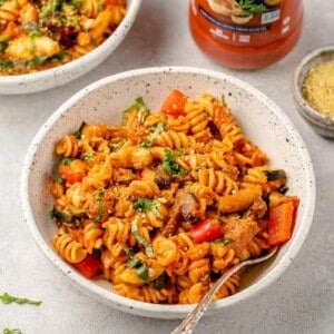 roasted vegetable pasta in a white ceramic bowl