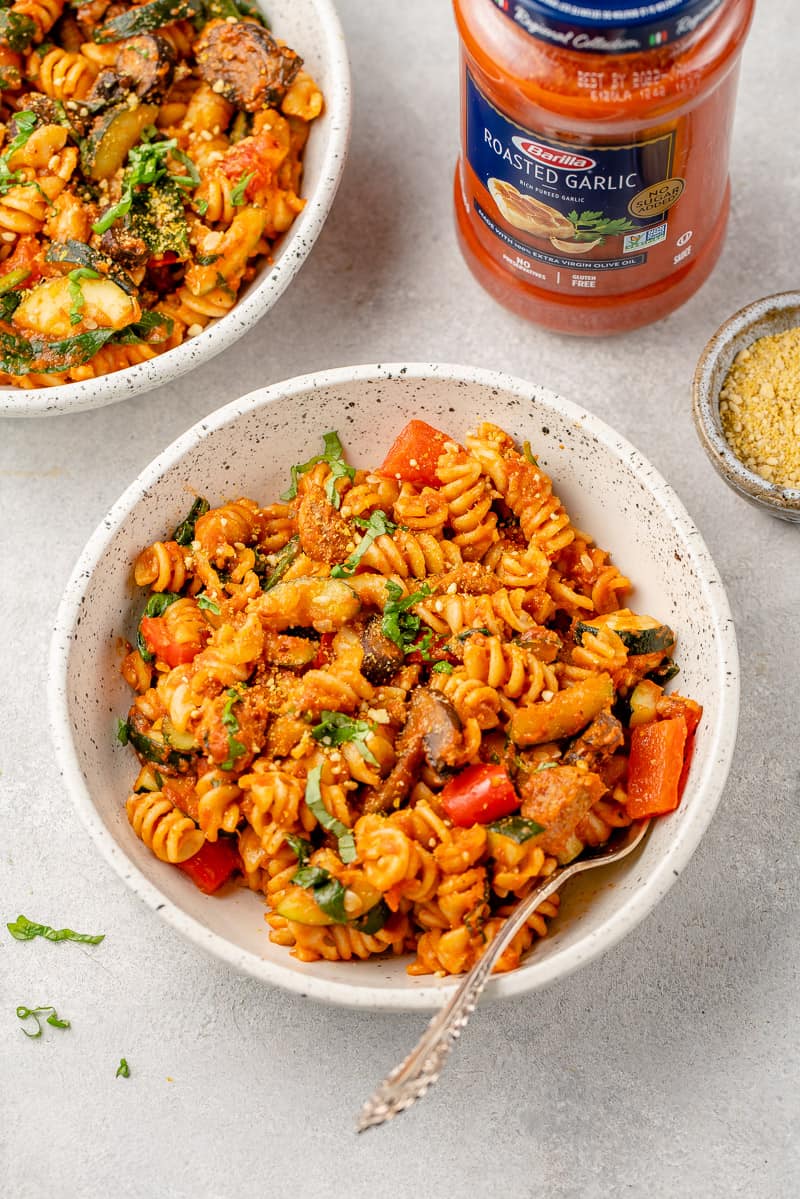 roasted vegetable pasta in a white ceramic bowl