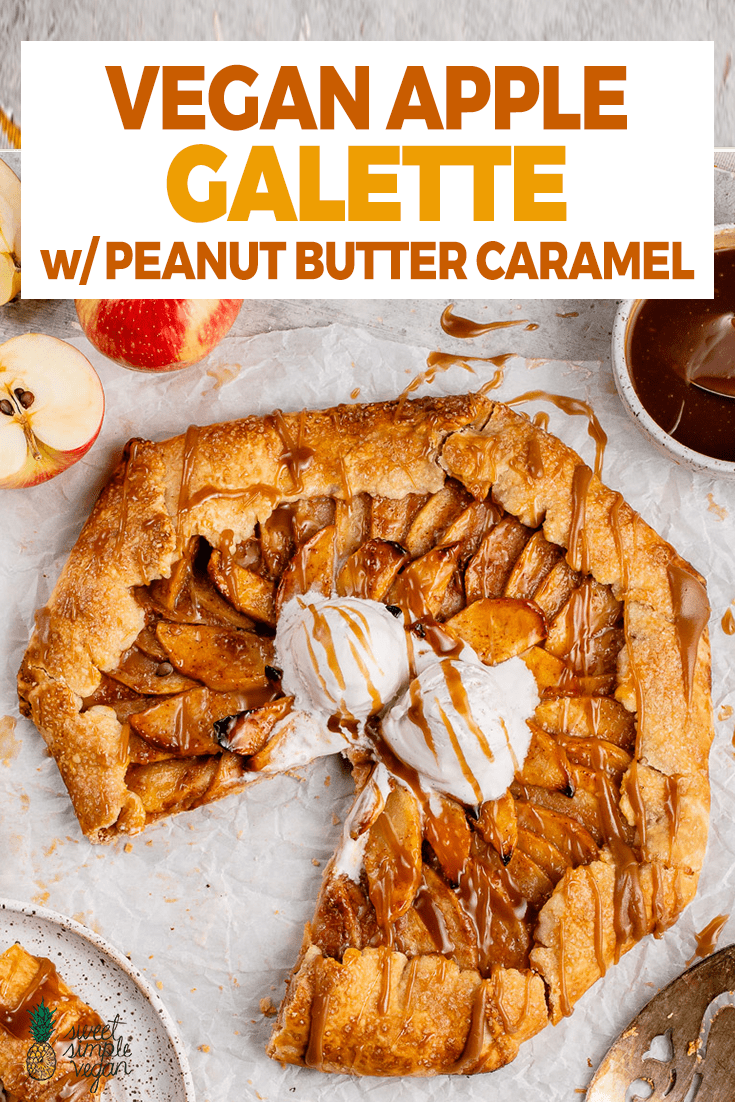 sliced vegan apple galette with vanilla ice cream and caramel sauce on a white board for pinterest