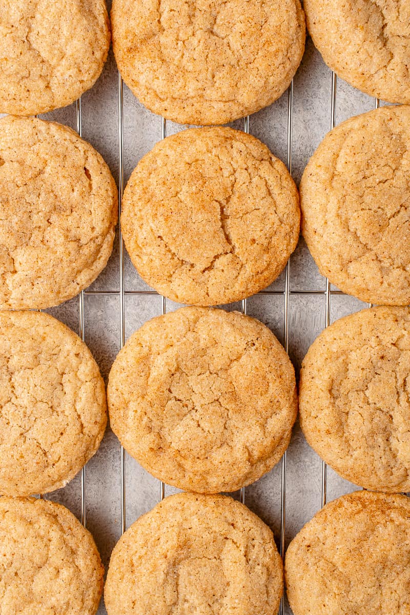 overhead photo of vegan eggnog snickerdoodle cookies on a cooling rack