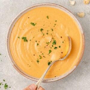 overhead image of bowl with chipotle crema and spoon
