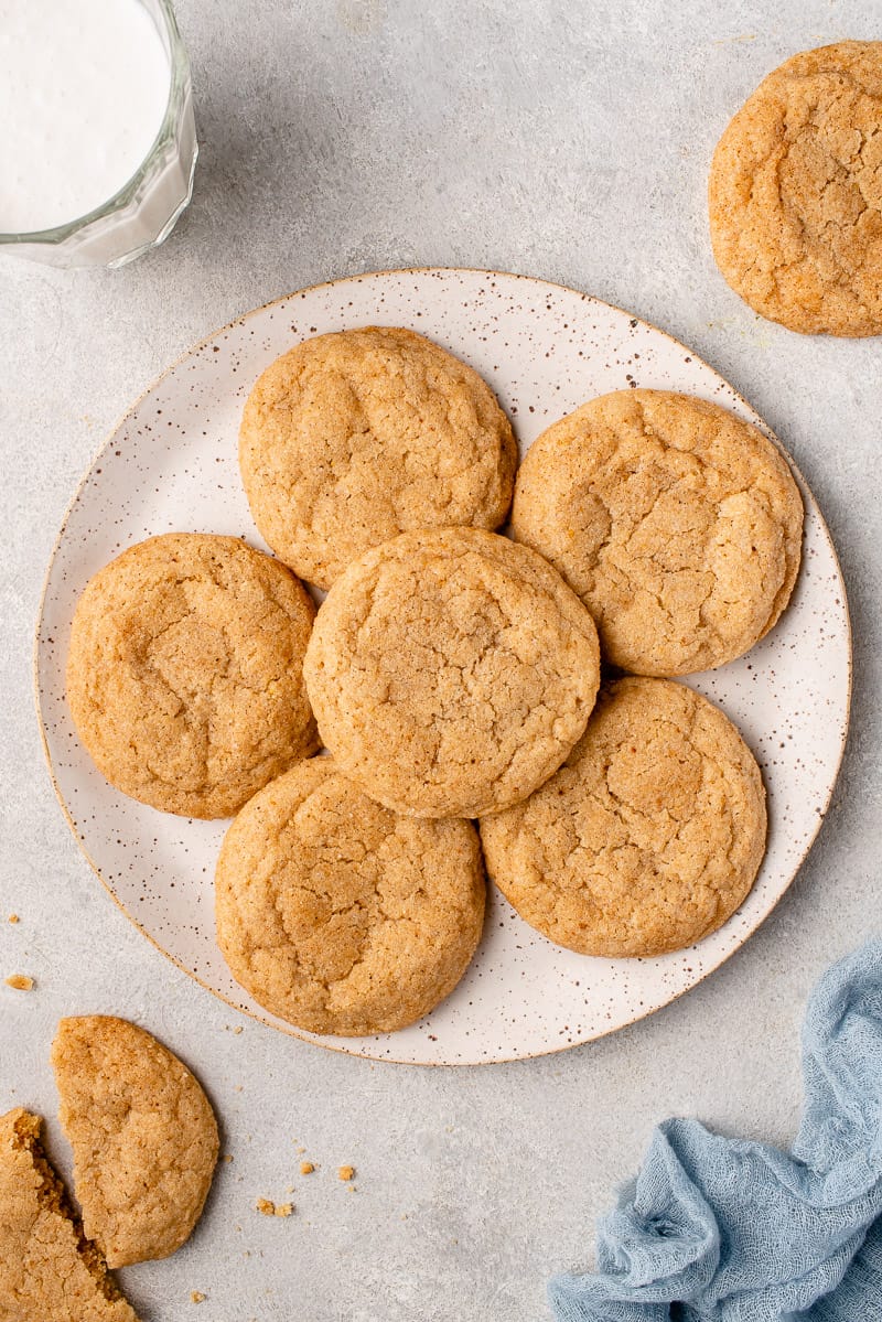 a white speckled plate with vegan eggnog snickerdoodle cookies