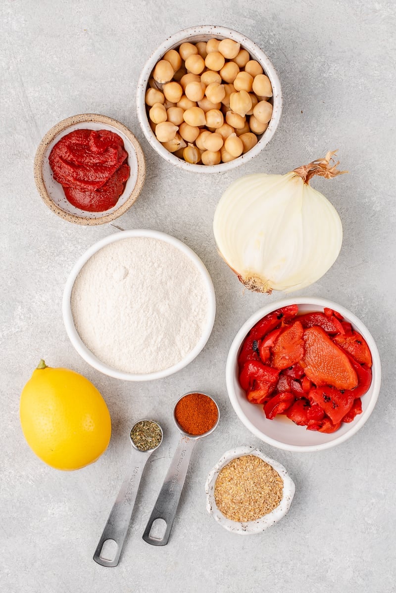 ingredients for chickpea burgers on a white board