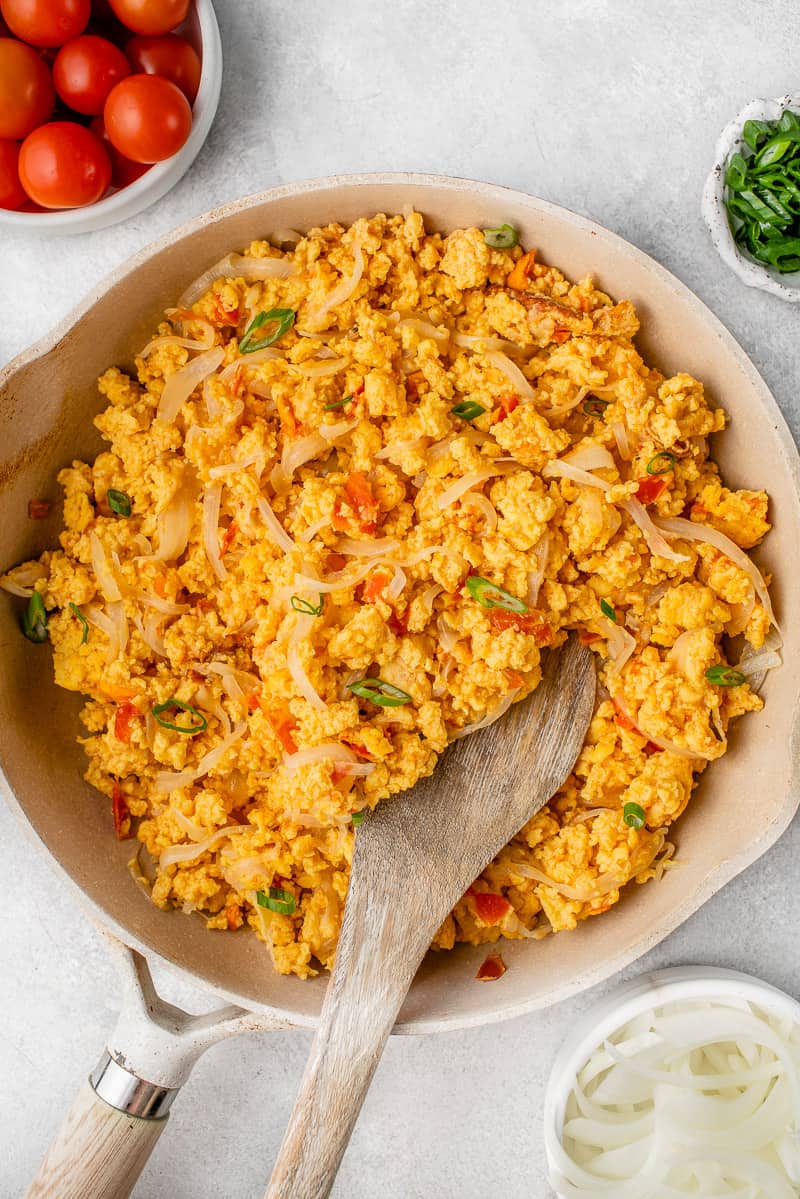 photo of filipino scrambled eggs in a pot surrounded by the ingredients