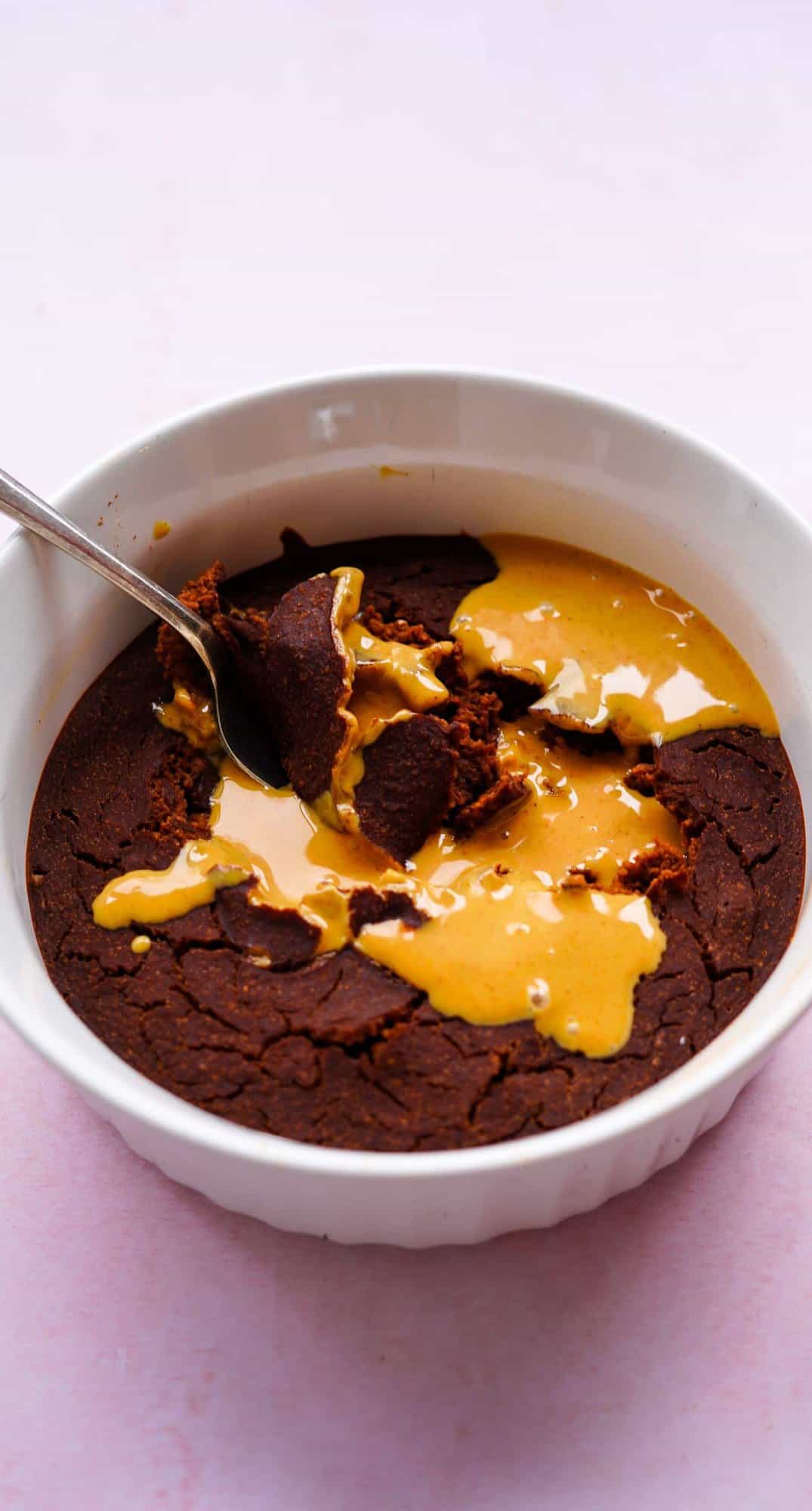 macro image of chocolate baked oatmeal gushing with peanut butter. 