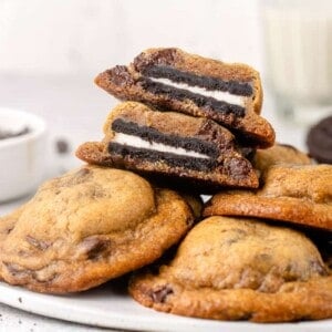 horizontal image of oreo stuffed chocolate chip cookies on a plate