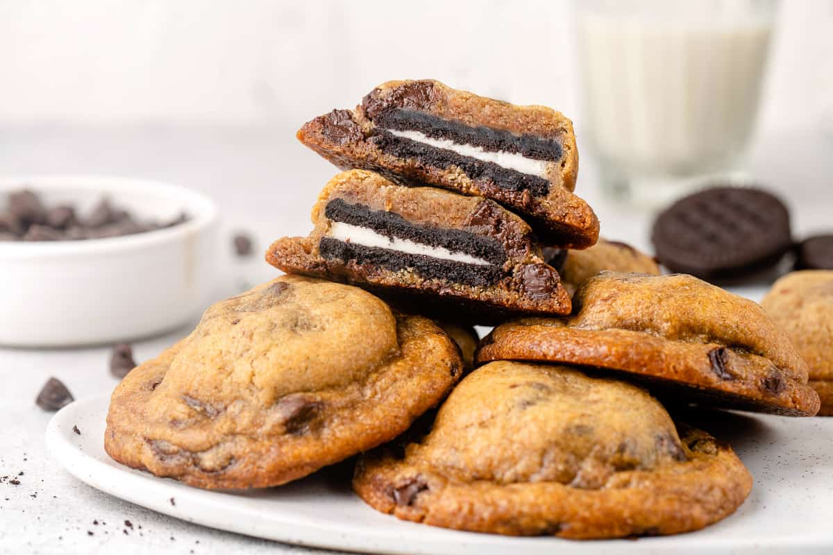 horizontal image of oreo stuffed chocolate chip cookies on a plate