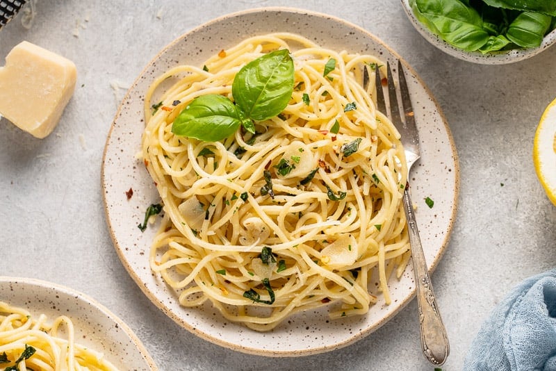 garlic and herb pasta on a white plate