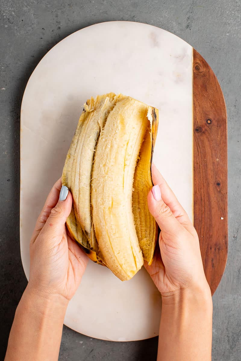 process shot of plantain being peeled