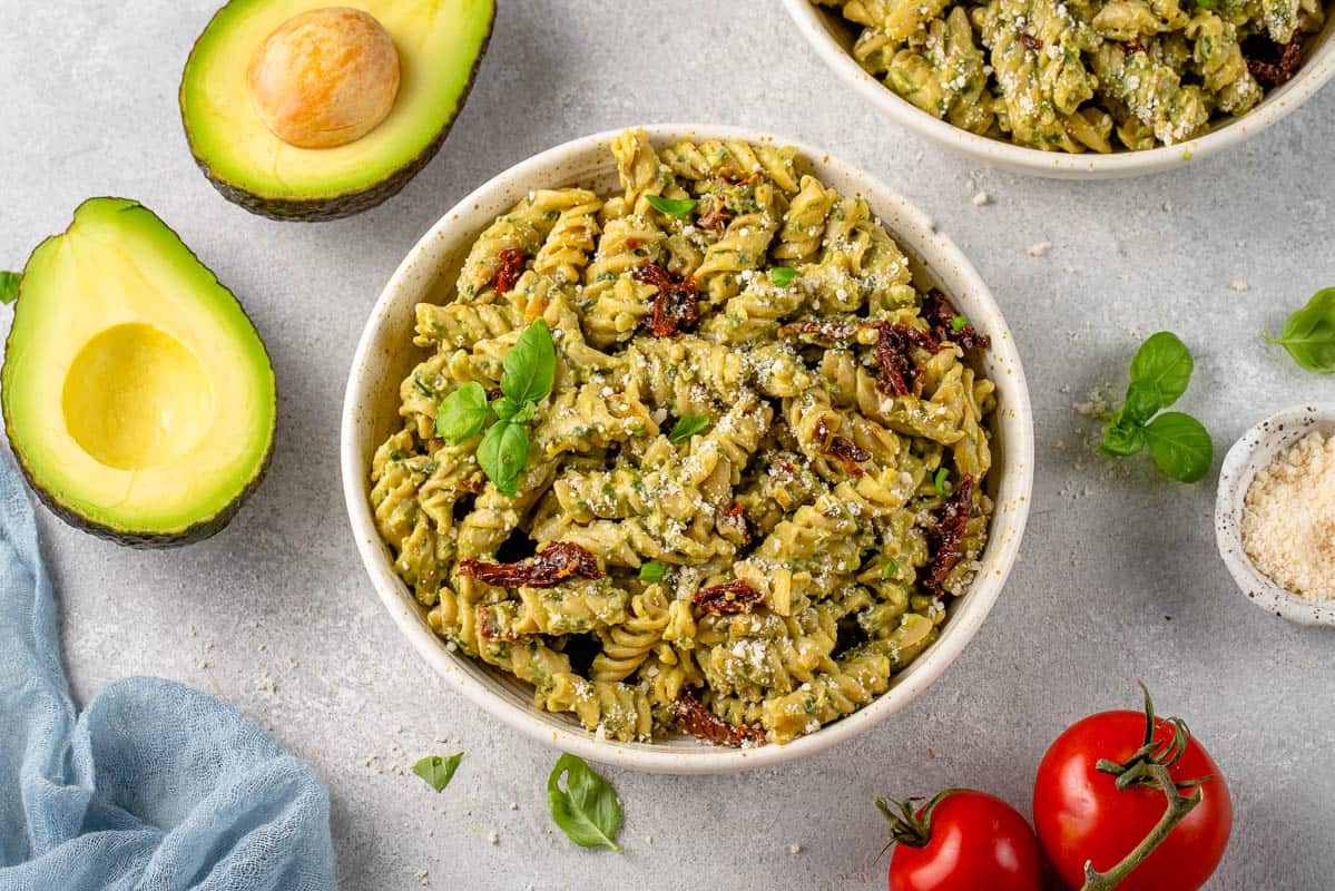 horizontal image of avocado pesto pasta