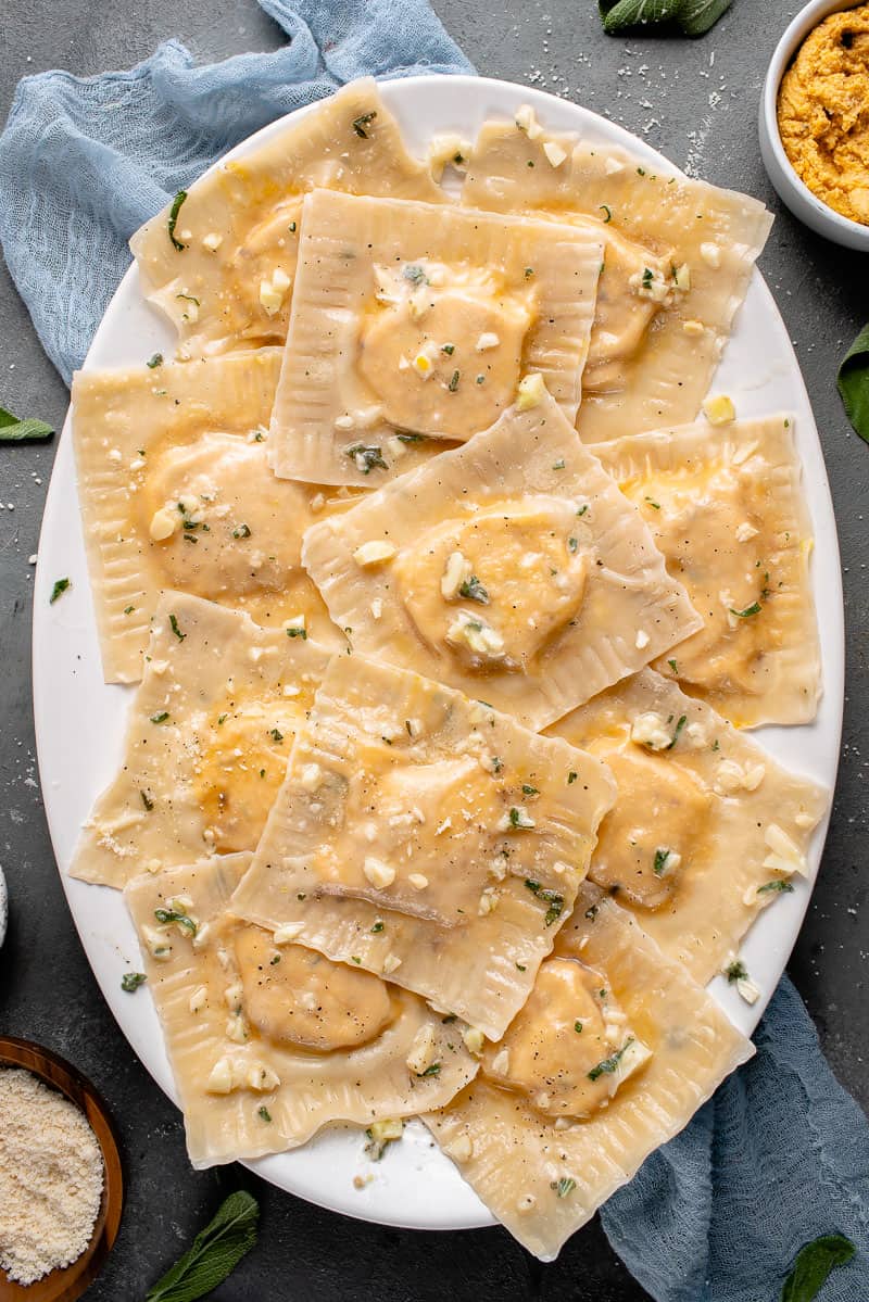 butternut squash ravioli on a white platter