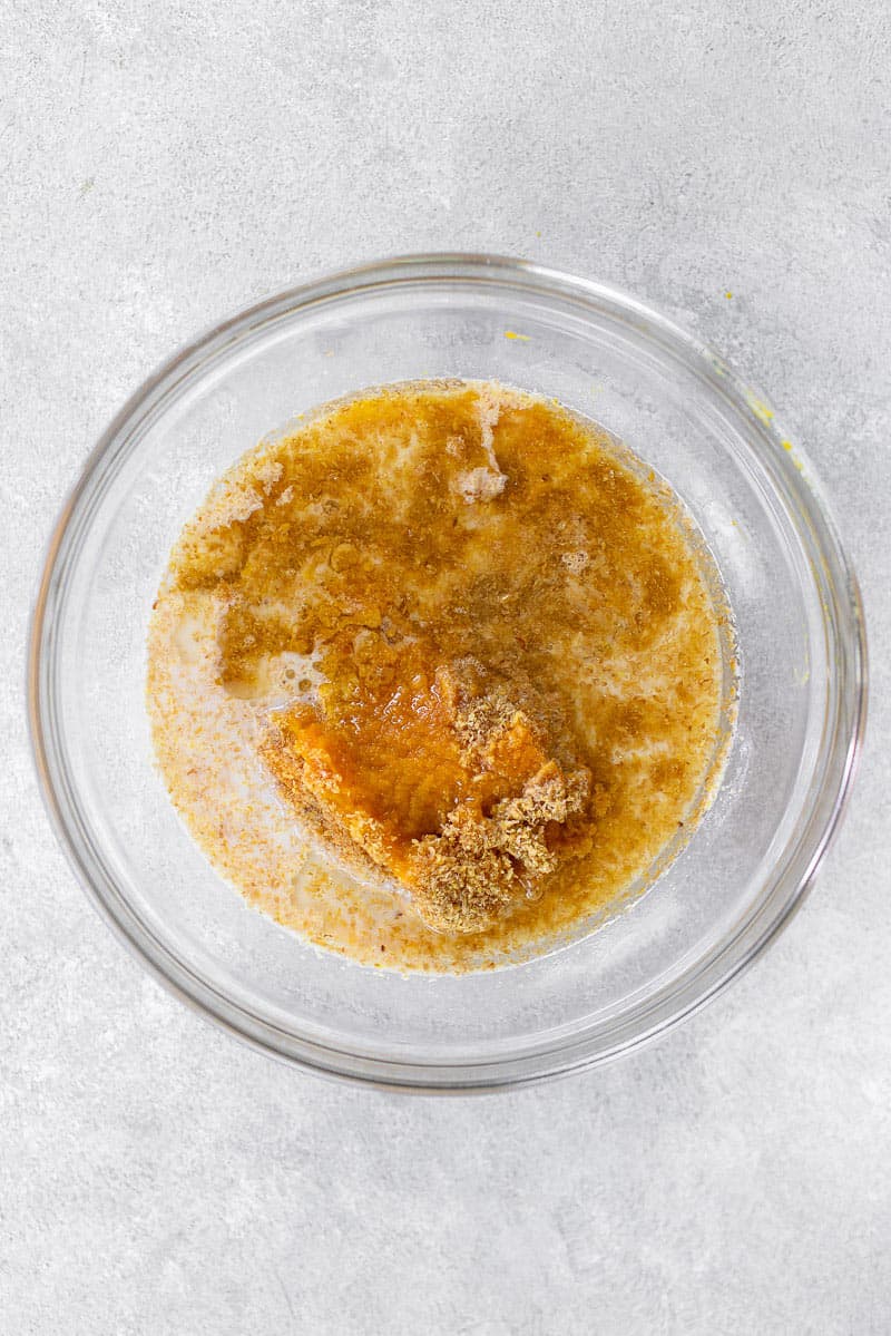 wet ingredients for pumpkin bread in mixing bowl