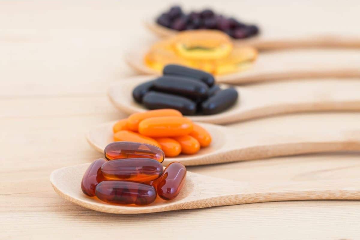 vegan supplements in wooden spoons
