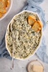 warm spinach artichoke dip with bread and parmesan