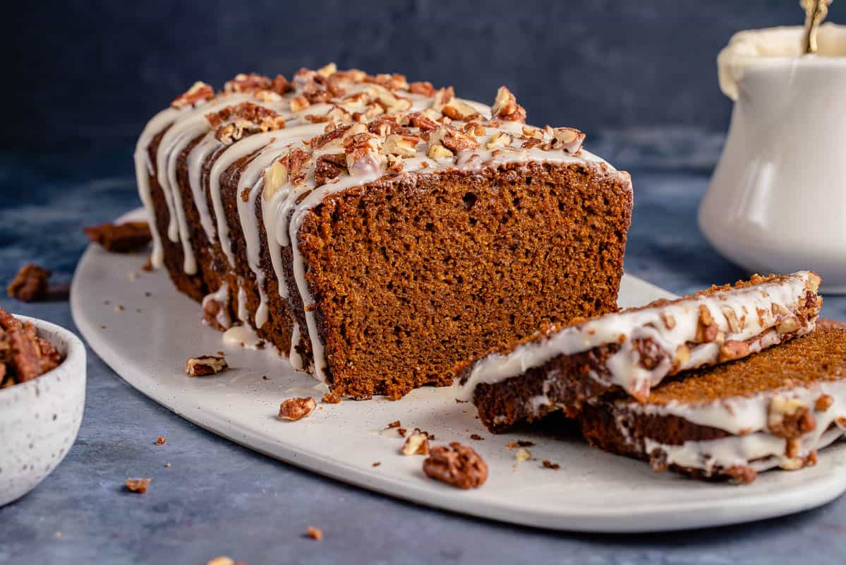 horizontal image of gingerbread loaf cake with slices
