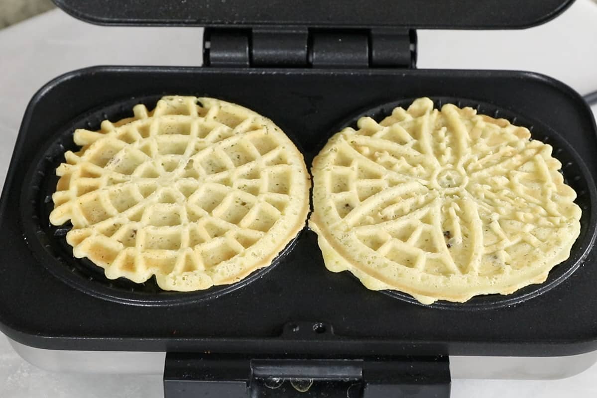 step by step of pizzelles being pressed