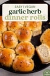 golden dinner rolls with herbs in a cast iron skillet for pinterest