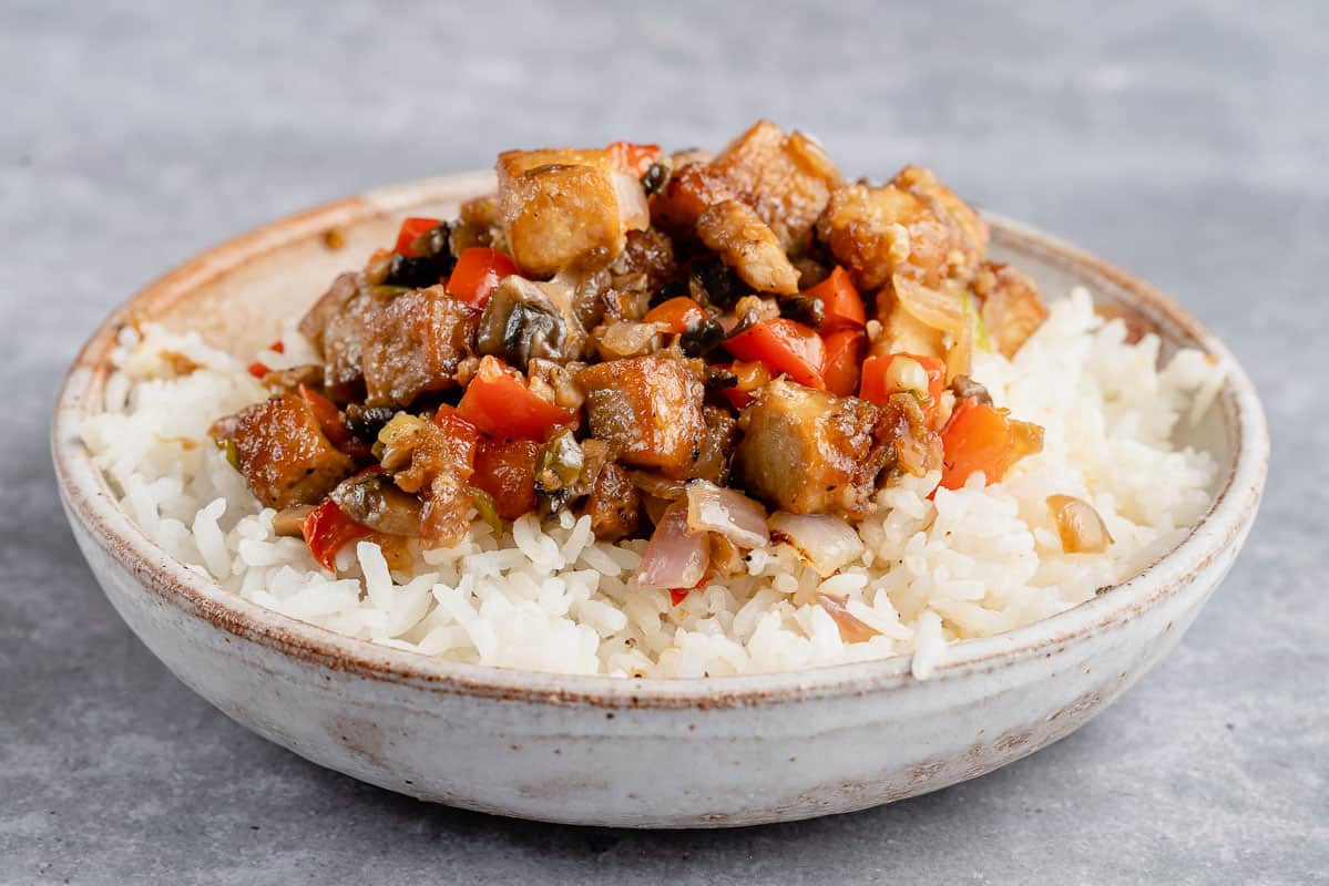 vegan tofu sisig in bowl with rice