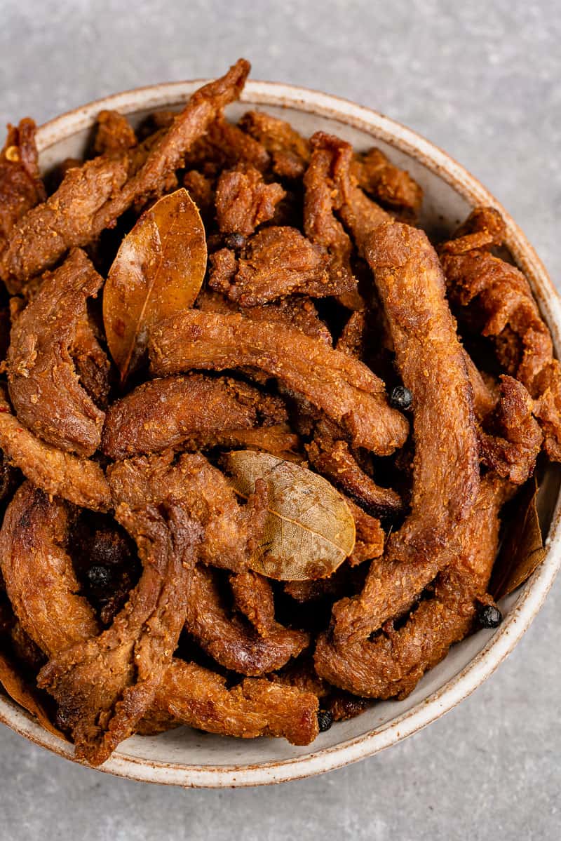 close up of white bowl with Filipino Adobo Inspired Jerky