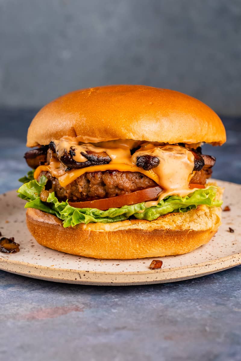 close up of vegan burger with Garlic Butter Miso Mushrooms