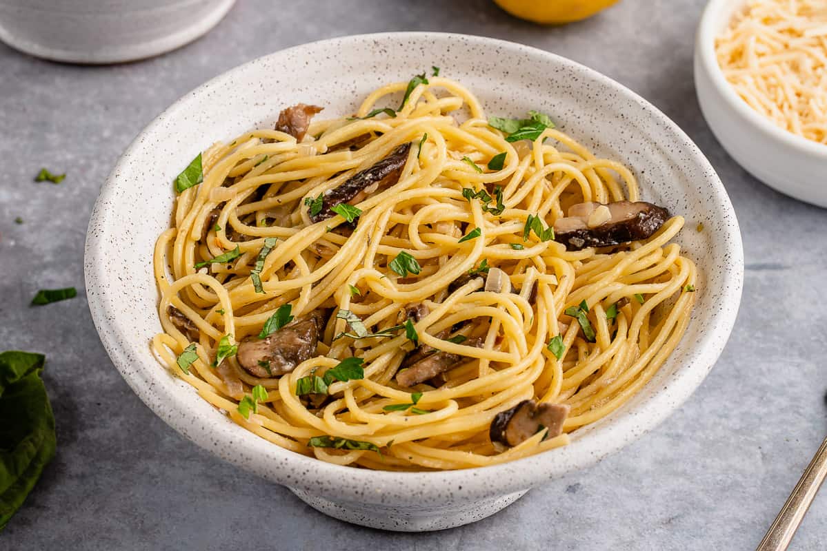 horizontal photo of Miso Garlic Butter Pasta in a white bowl