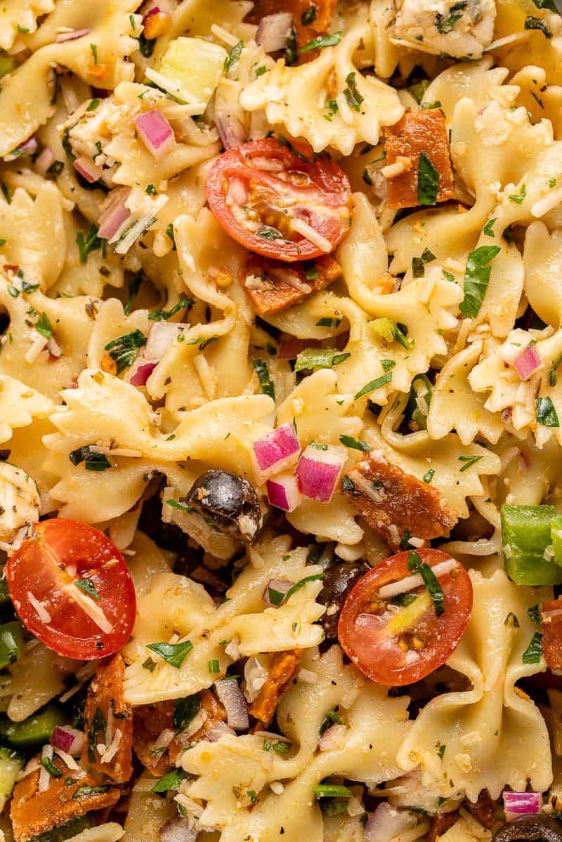 close up of Italian-Inspired Pasta Salad in blue bowl