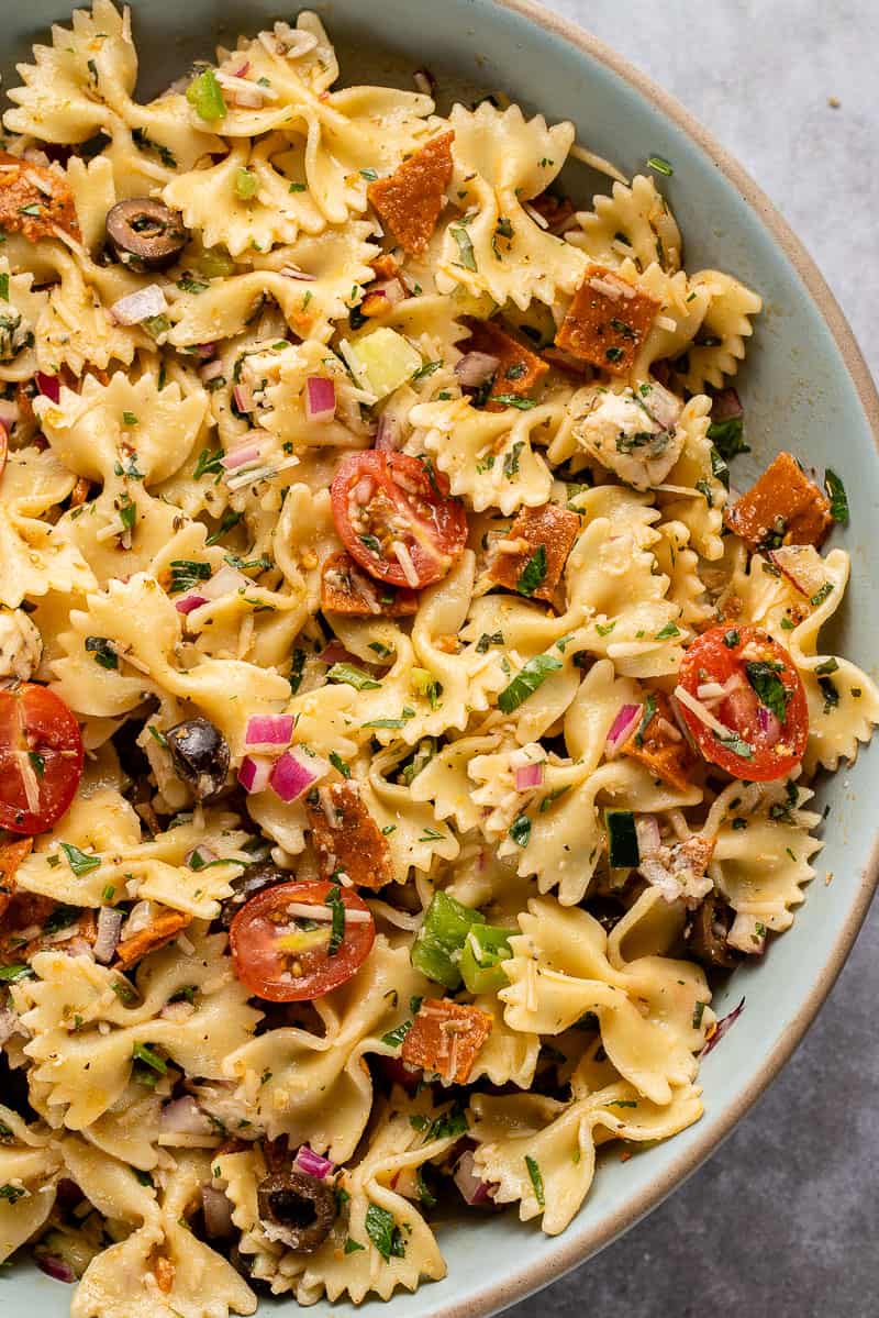 close up of Italian-Inspired Pasta Salad in blue bowl