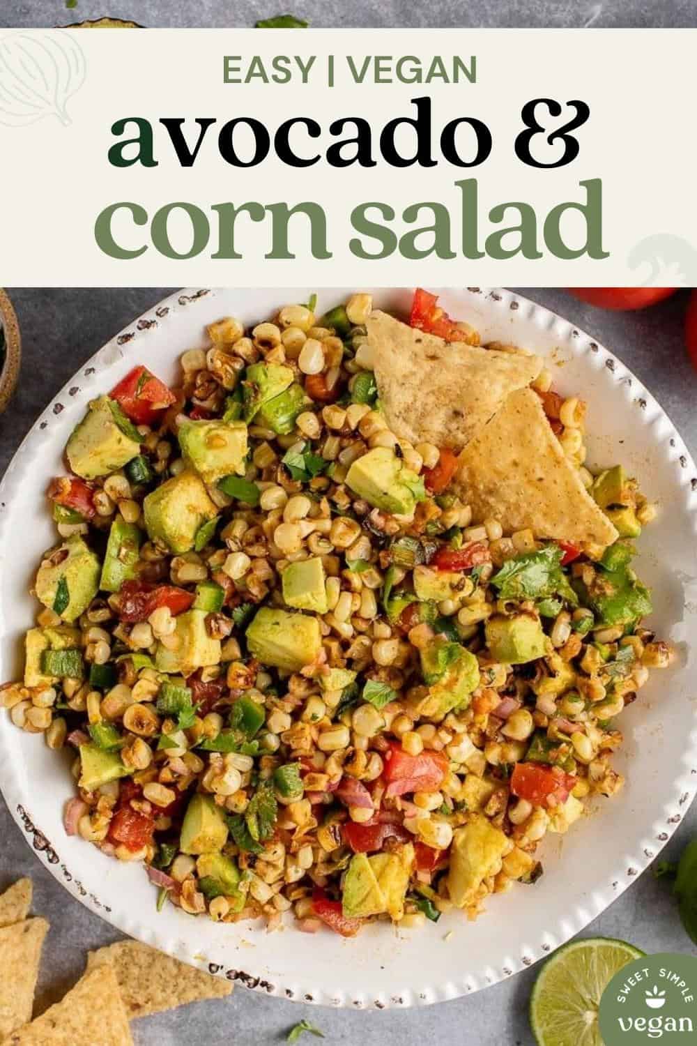 vertical photo of Avocado and Roasted Corn Salad in white bowl for pinterest
