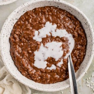 verticle image of champorado with spoon