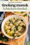 vertical image of vegan tinolang manok on wood board and styled background for pinterest